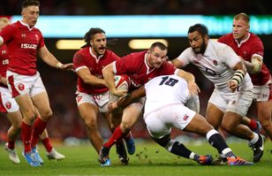 Ken Owens of Wales is tackled by Kyle Sinckler and Billy Vunipola of England on August 17, 2019