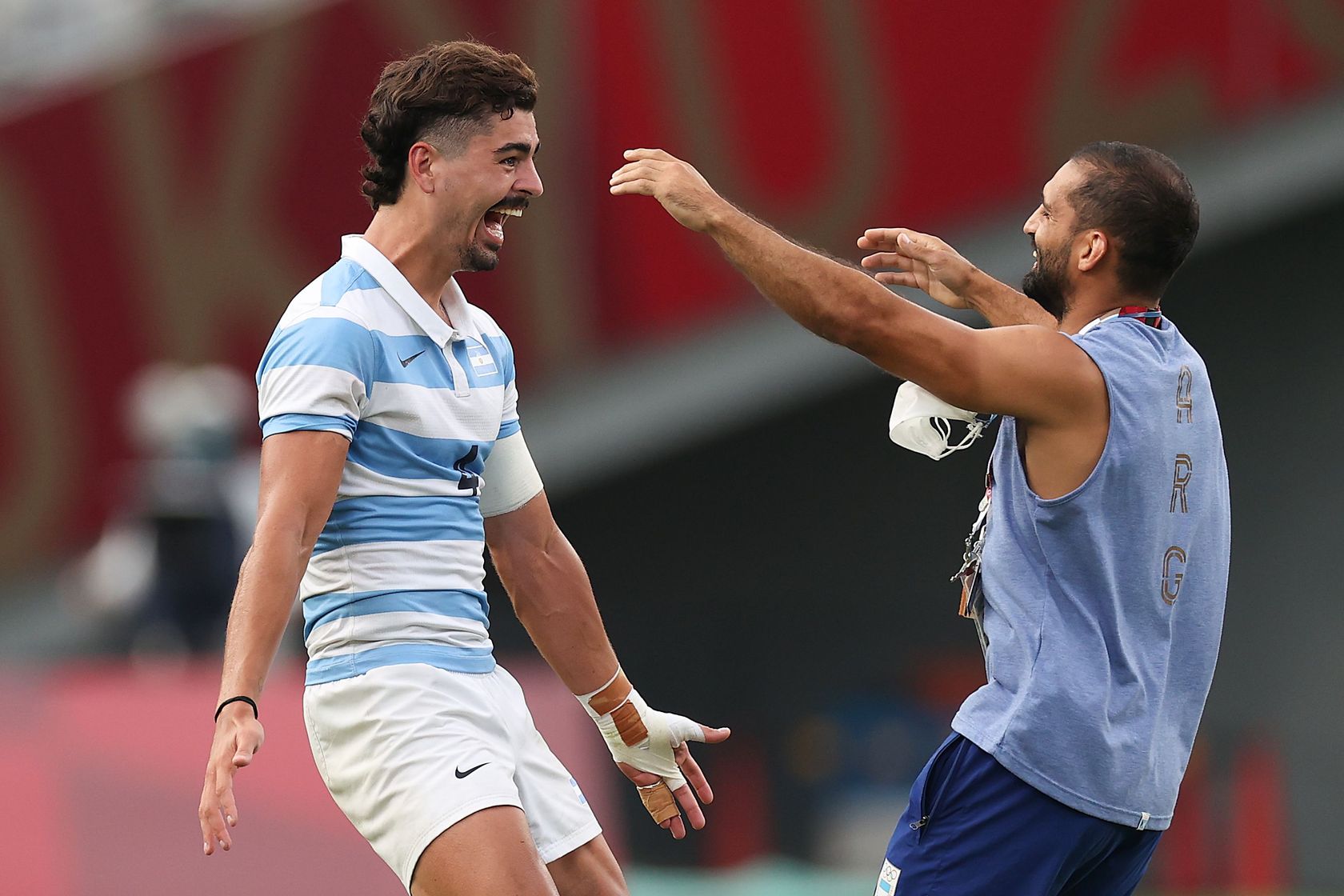 Photo of Argentina's Ignacio Mendy and Gaston Revol of Argentina celebrate after their victory during the Rugby Sevens Men's Bronze Medal match against Great Britain during the Tokyo 2020 Olympic Games